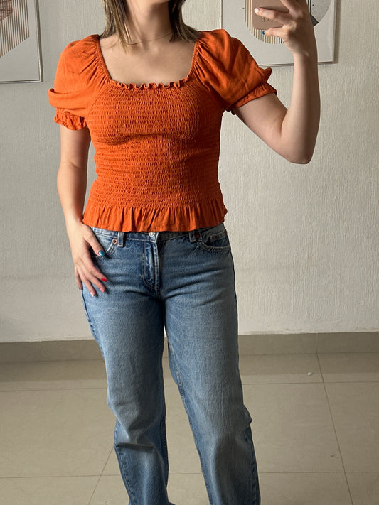 Blusa naranja elástica
